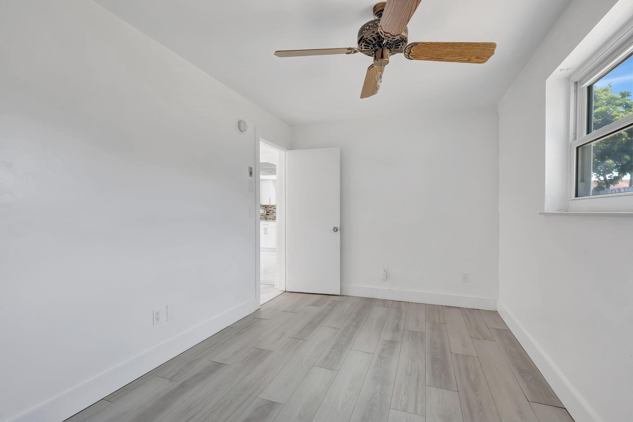 334 Southwest 13th Avenue Boynton Beach, FL 33435 - Photo 24 of 41 a view of a room with wooden floor closet and windows