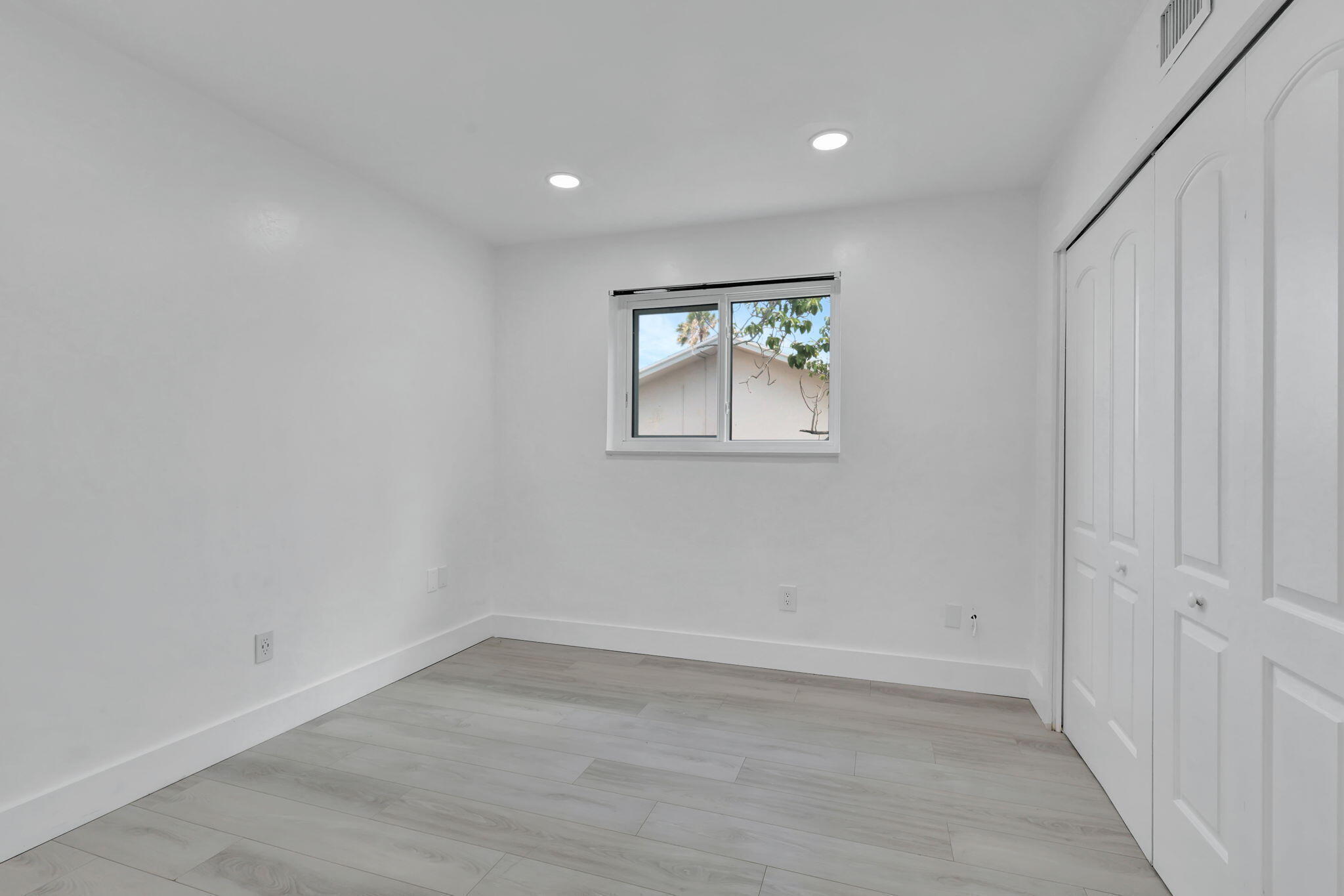 334 Southwest 13th Avenue Boynton Beach, FL 33435 - Photo 26 of 41 wooden floor in an empty room with a window