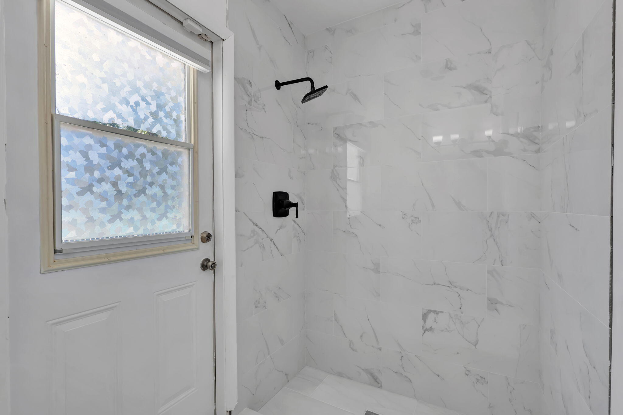 334 Southwest 13th Avenue Boynton Beach, FL 33435 - Photo 32 of 41 a bathroom with a shower