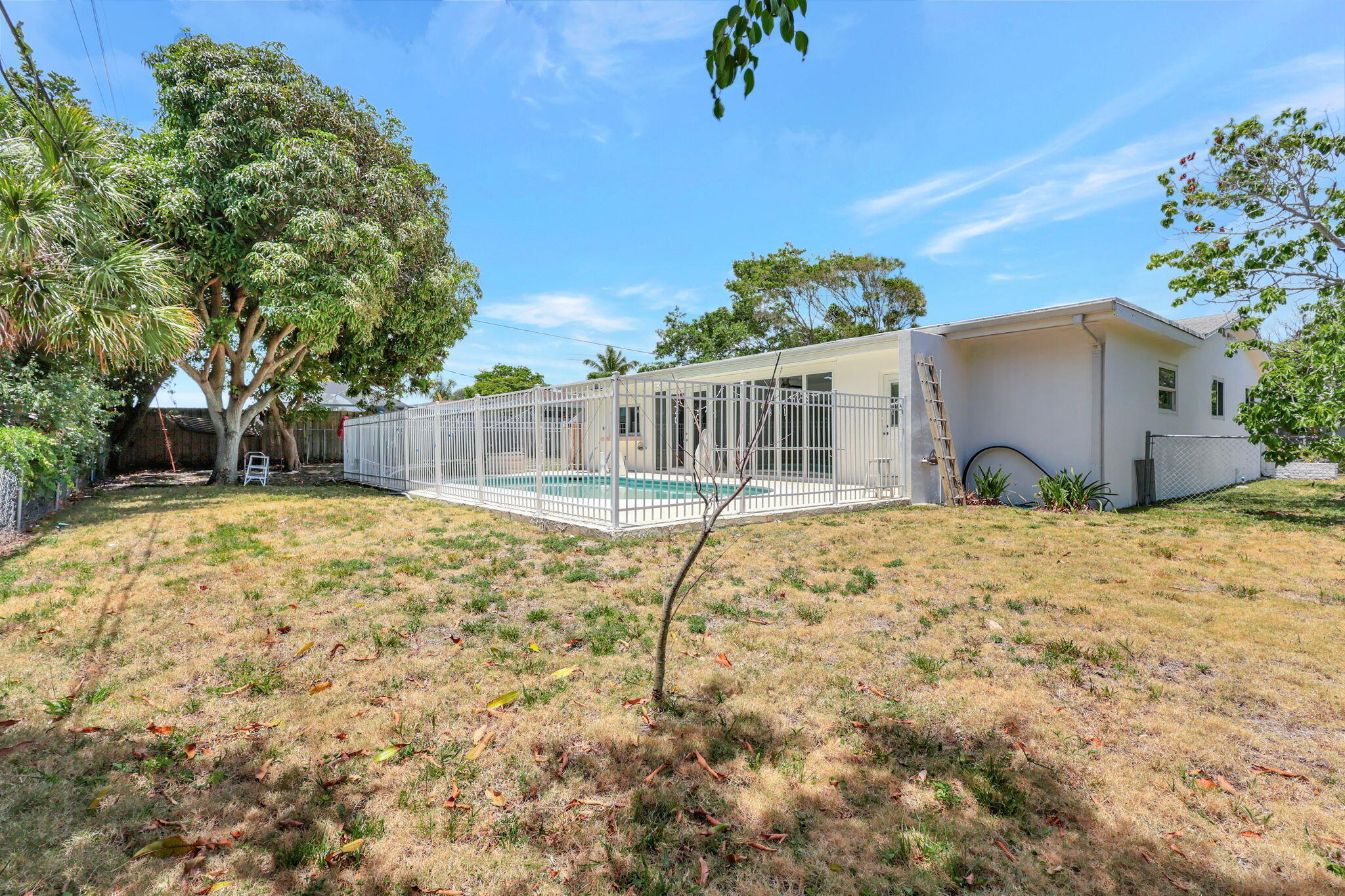 334 Southwest 13th Avenue Boynton Beach, FL 33435 - Photo 37 of 41 a view of a house with a yard