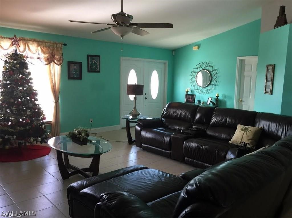 239 Rue Labonne Road Fort Myers, FL 33913 - Photo 13 of 22 a living room with furniture and a large window
