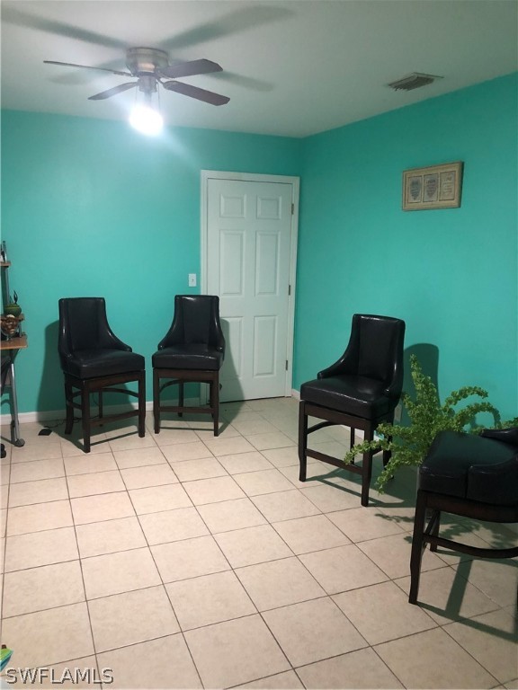 239 Rue Labonne Road Fort Myers, FL 33913 - Photo 16 of 22 a living room with furniture and a potted plant