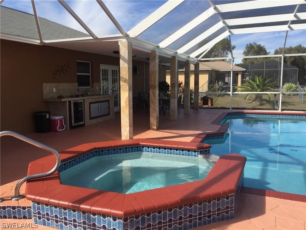 239 Rue Labonne Road Fort Myers, FL 33913 - Photo 5 of 22 a swimming pool with outdoor seating