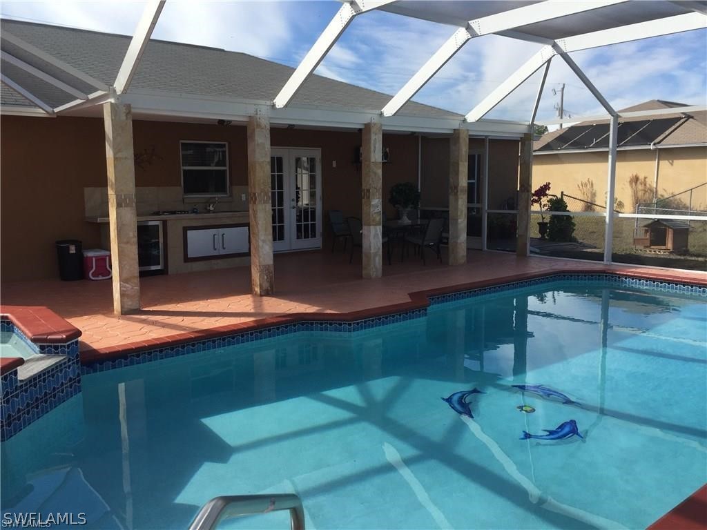 239 Rue Labonne Road Fort Myers, FL 33913 - Photo 6 of 22 a swimming pool with patio outdoor seating and yard