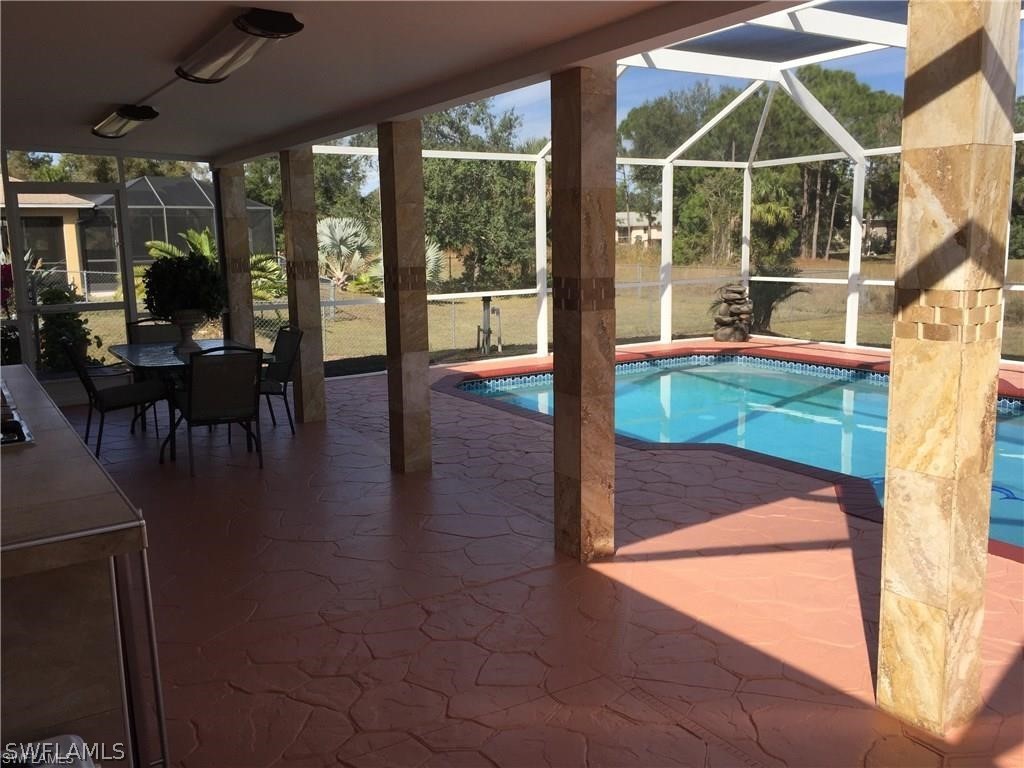 239 Rue Labonne Road Fort Myers, FL 33913 - Photo 7 of 22 a house view with a swimming pool