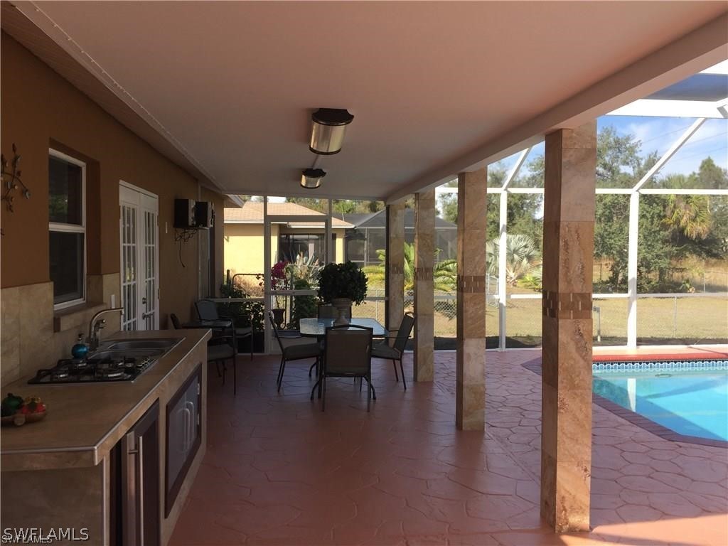 239 Rue Labonne Road Fort Myers, FL 33913 - Photo 8 of 22 a lobby with furniture and floor to ceiling window