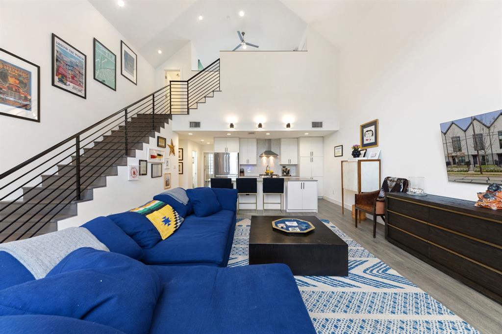 3880 Munger Avenue, Unit 2 Dallas, TX 75204 - Photo 13 of 29 a living room with furniture kitchen view and a rug