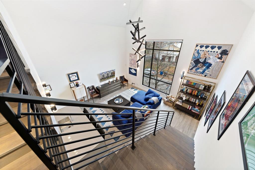 3880 Munger Avenue, Unit 2 Dallas, TX 75204 - Photo 15 of 29 a living room with furniture a rug and a book shelf