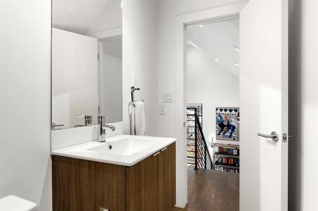 3880 Munger Avenue, Unit 2 Dallas, TX 75204 - Photo 18 of 29 a bathroom with a sink and a mirror