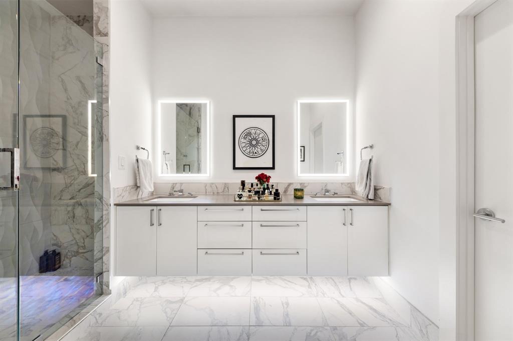 3880 Munger Avenue, Unit 2 Dallas, TX 75204 - Photo 22 of 29 a bathroom with a sink and a mirror