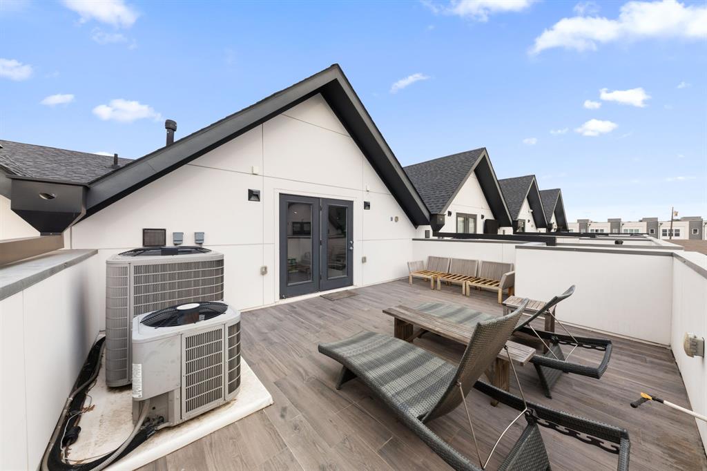 3880 Munger Avenue, Unit 2 Dallas, TX 75204 - Photo 28 of 29 a view of a roof deck with furniture