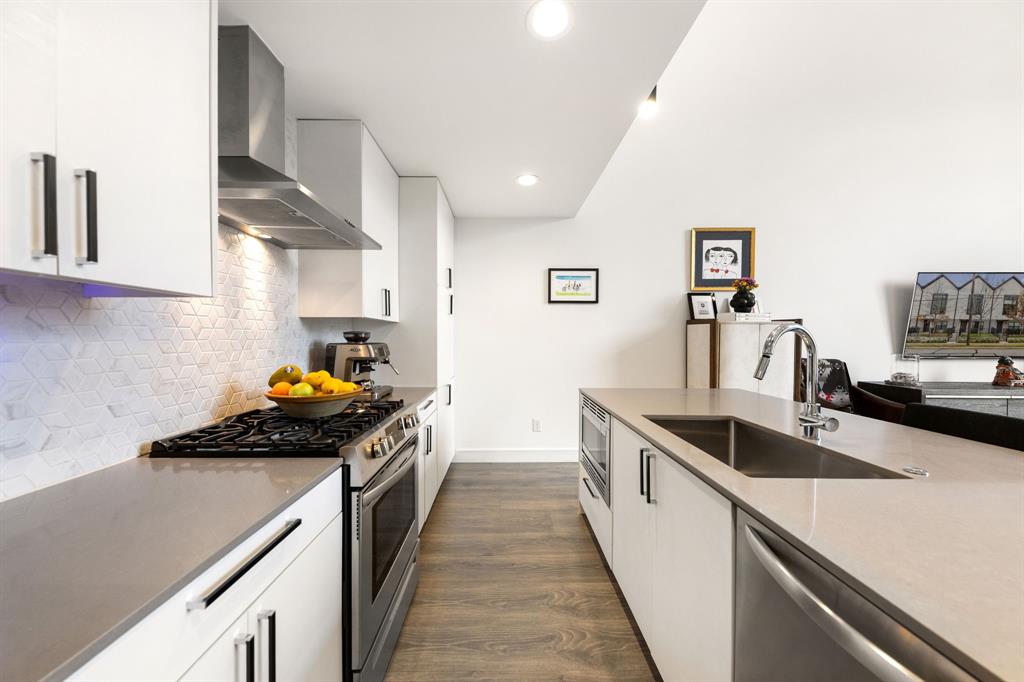 3880 Munger Avenue, Unit 2 Dallas, TX 75204 - Photo 6 of 29 a kitchen with a sink and a stove top oven