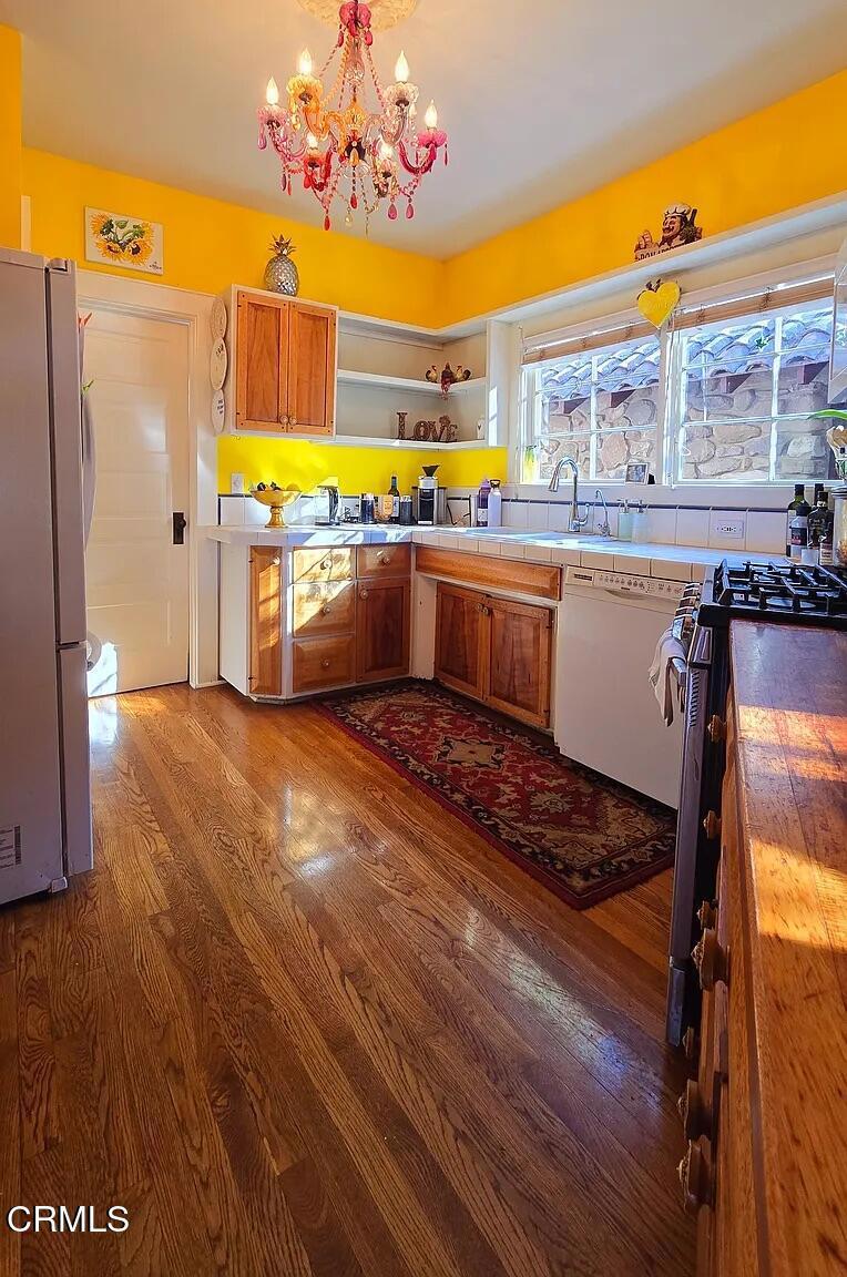 1450 McAndrew Road Ojai, CA 93023 - Photo 14 of 58 a kitchen with stainless steel appliances granite countertop a sink and cabinets