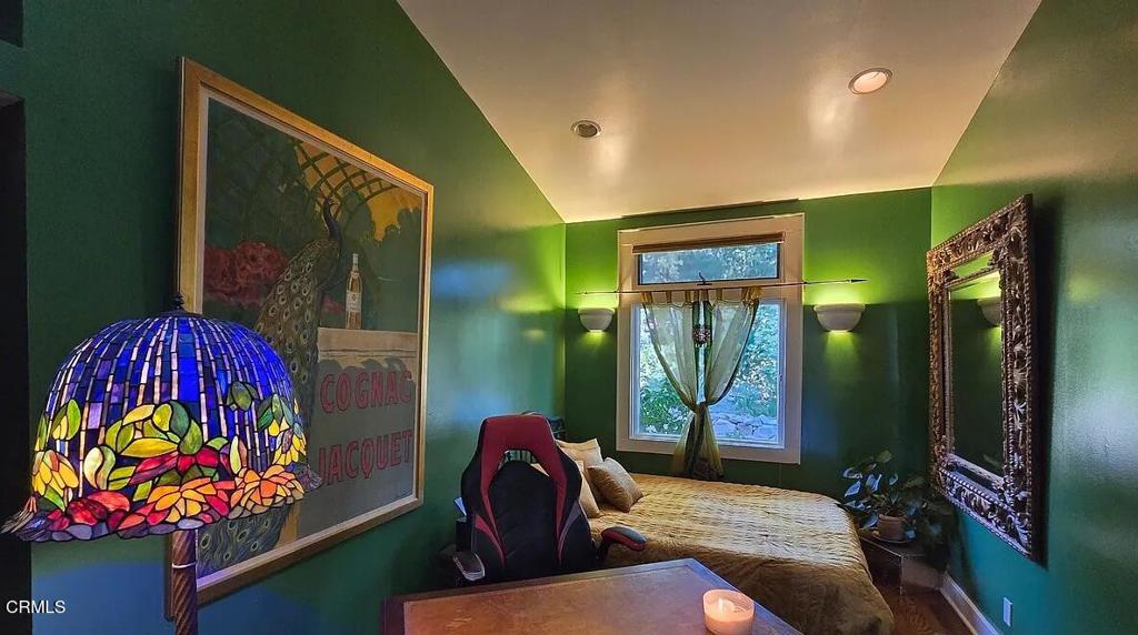 1450 McAndrew Road Ojai, CA 93023 - Photo 16 of 58 a living room with furniture and a painting on the wall