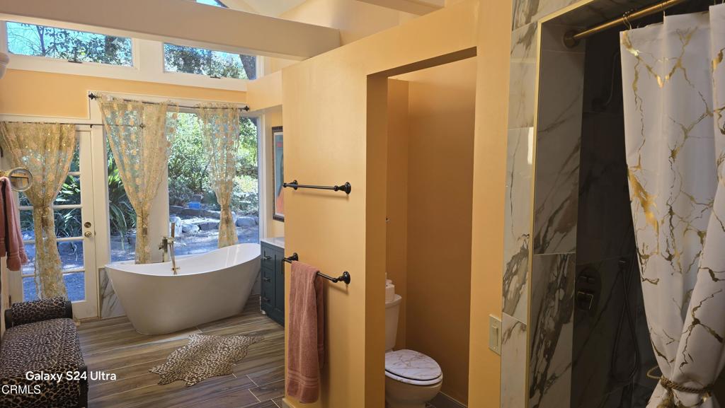 1450 McAndrew Road Ojai, CA 93023 - Photo 21 of 58 a bathroom with a bathtub and shower