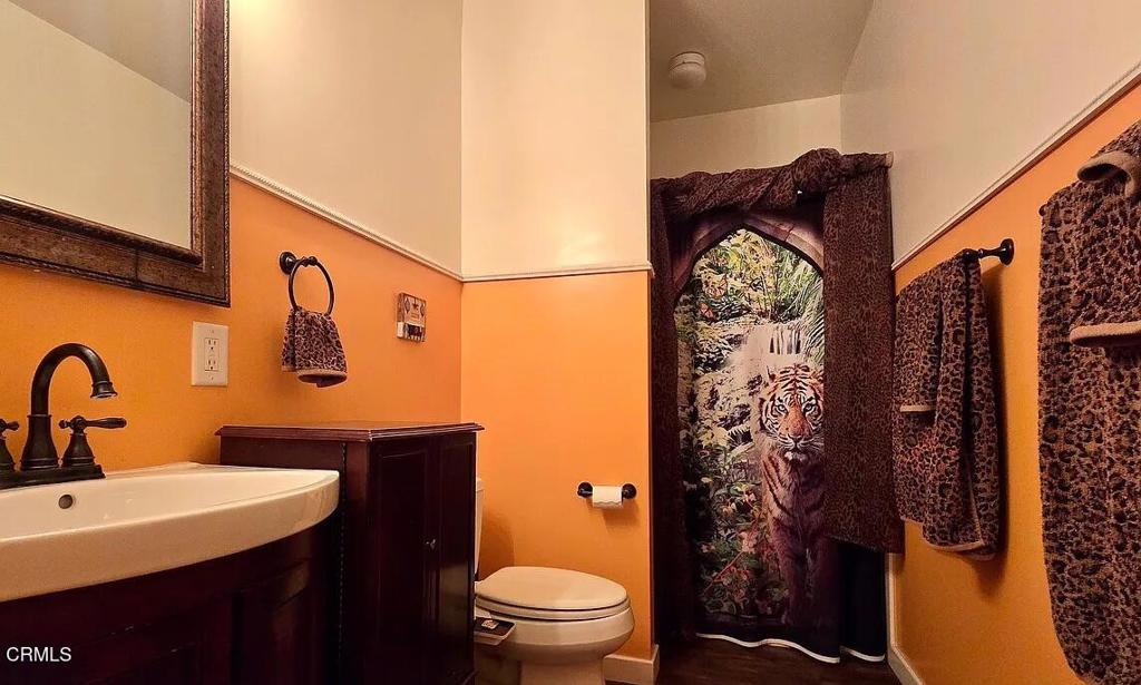 1450 McAndrew Road Ojai, CA 93023 - Photo 22 of 58 a bathroom with a sink a toilet and shower