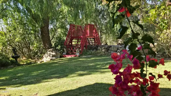 a view of a yard covered with snow in the background