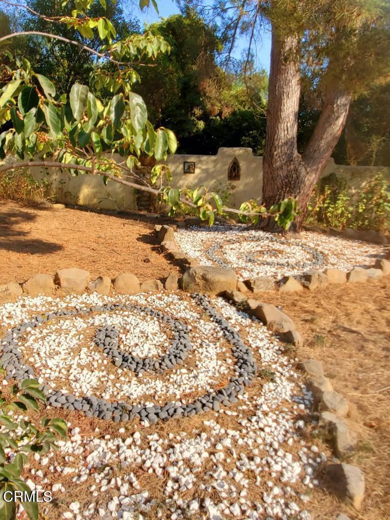 1450 McAndrew Road Ojai, CA 93023 - Photo 25 of 58 a view of a yard covered in snow