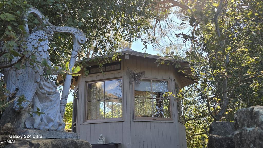 1450 McAndrew Road Ojai, CA 93023 - Photo 28 of 58 a front view of a house with garden