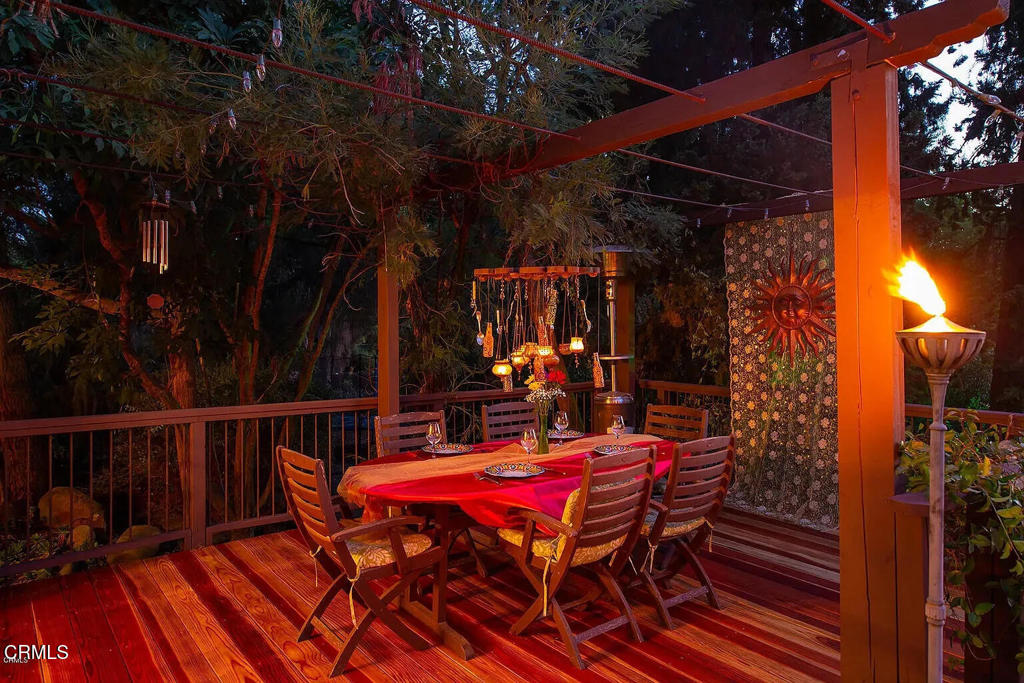 1450 McAndrew Road Ojai, CA 93023 - Photo 3 of 58 a view of a patio with table and chairs with wooden floor and fence