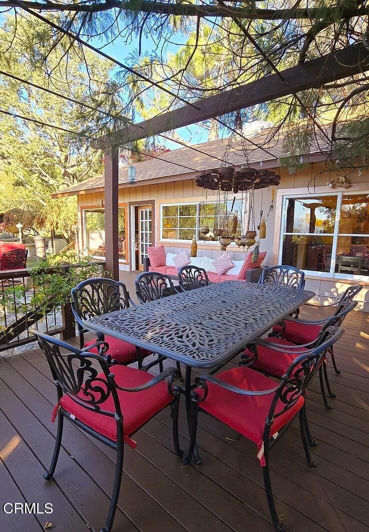 1450 McAndrew Road Ojai, CA 93023 - Photo 35 of 58 a view of a patio with a table and chairs