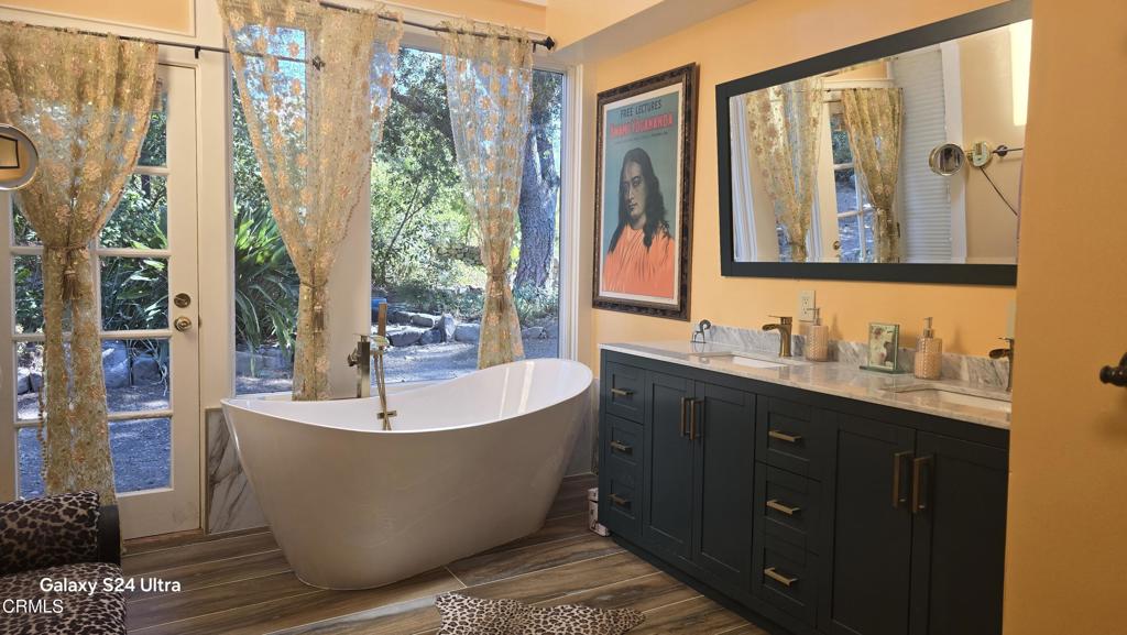 1450 McAndrew Road Ojai, CA 93023 - Photo 4 of 58 a bathroom with a bathtub and sink