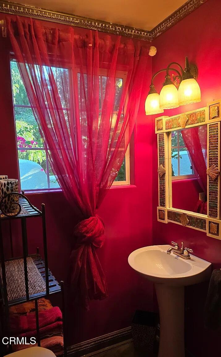 1450 McAndrew Road Ojai, CA 93023 - Photo 47 of 58 a bathroom with a sink and a mirror