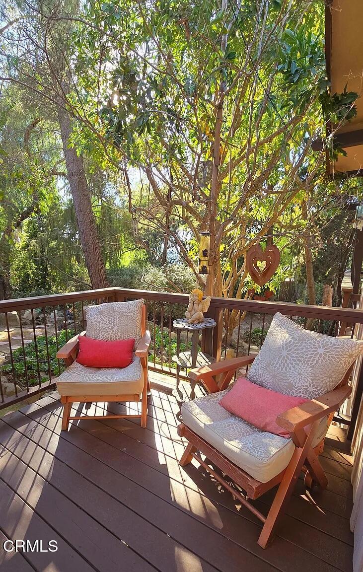 1450 McAndrew Road Ojai, CA 93023 - Photo 54 of 58 an outdoor sitting area with furniture and wooden floor