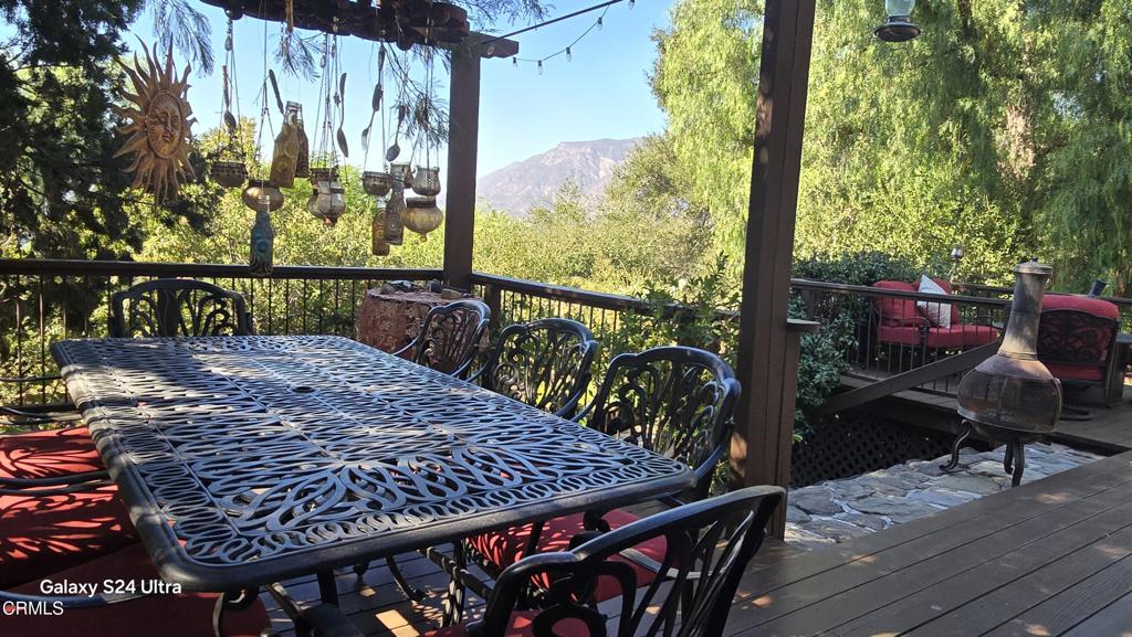 1450 McAndrew Road Ojai, CA 93023 - Photo 8 of 58 a view of balcony with wooden floor and outdoor seating