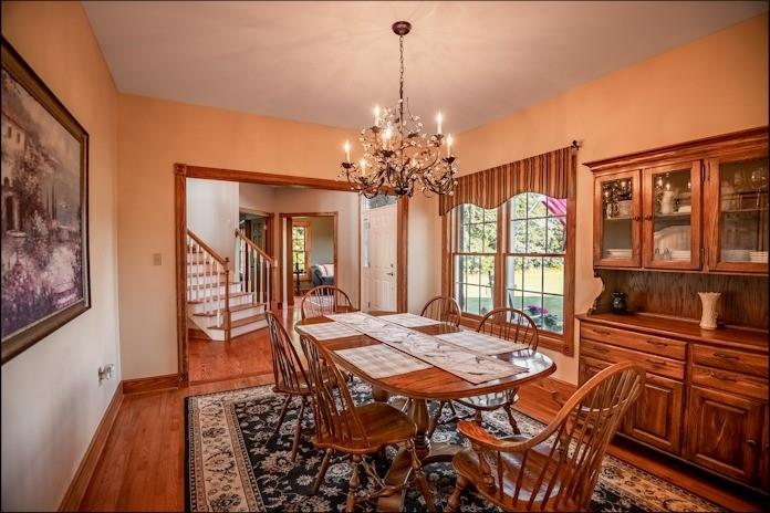 463 Gerber Road Volant, PA 16156 - Photo 12 of 25 a view of a dining room with furniture window and wooden floor