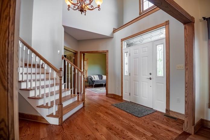 463 Gerber Road Volant, PA 16156 - Photo 3 of 25 a view of a hallway with wooden floor and staircase