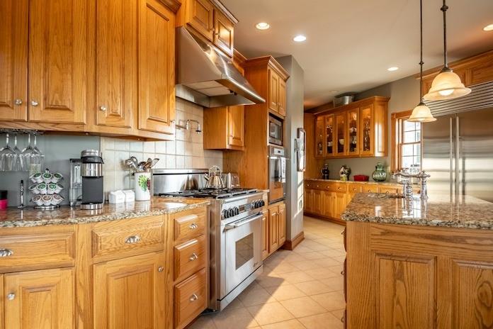 463 Gerber Road Volant, PA 16156 - Photo 8 of 25 a kitchen with stainless steel appliances granite countertop a stove a sink and a refrigerator