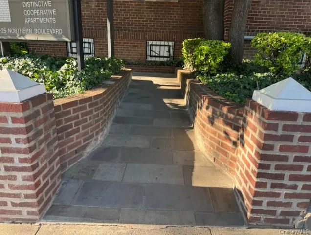 a view of a backyard with sitting area