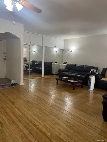 a view of a room with wooden floor