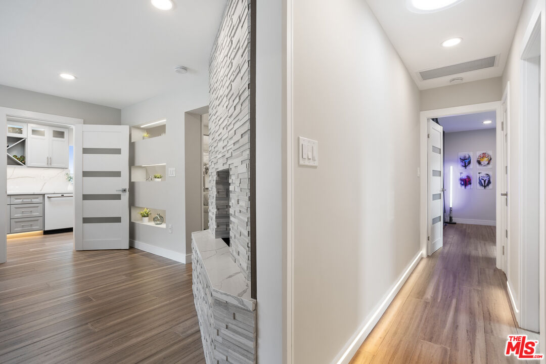 393 Allendale Road Pasadena, CA 91106 - Photo 25 of 75 a view of a hallway with wooden floor and closet