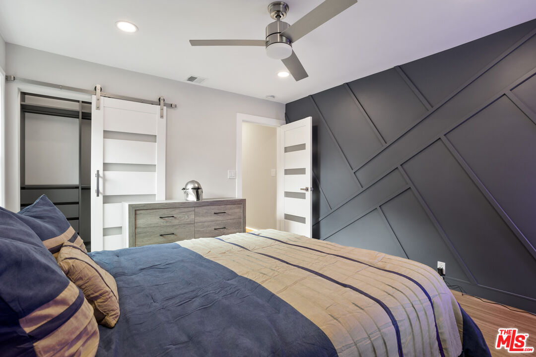 393 Allendale Road Pasadena, CA 91106 - Photo 33 of 75 a bedroom with a large bed and a window