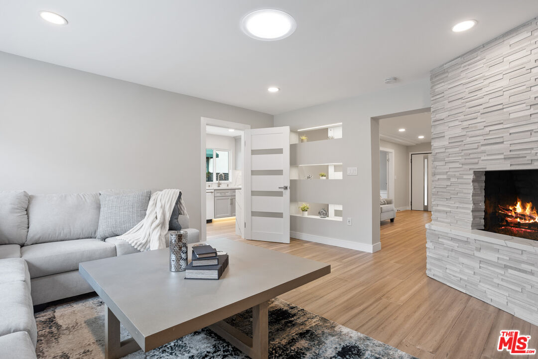 393 Allendale Road Pasadena, CA 91106 - Photo 35 of 75 a workspace with furniture and wooden floor