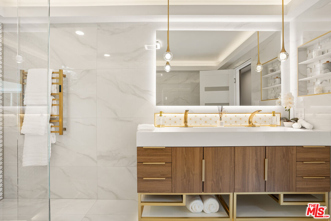 393 Allendale Road Pasadena, CA 91106 - Photo 40 of 75 a bathroom with a sink and a mirror