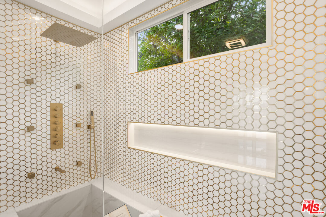 393 Allendale Road Pasadena, CA 91106 - Photo 44 of 75 a bathroom with a bathtub and shower