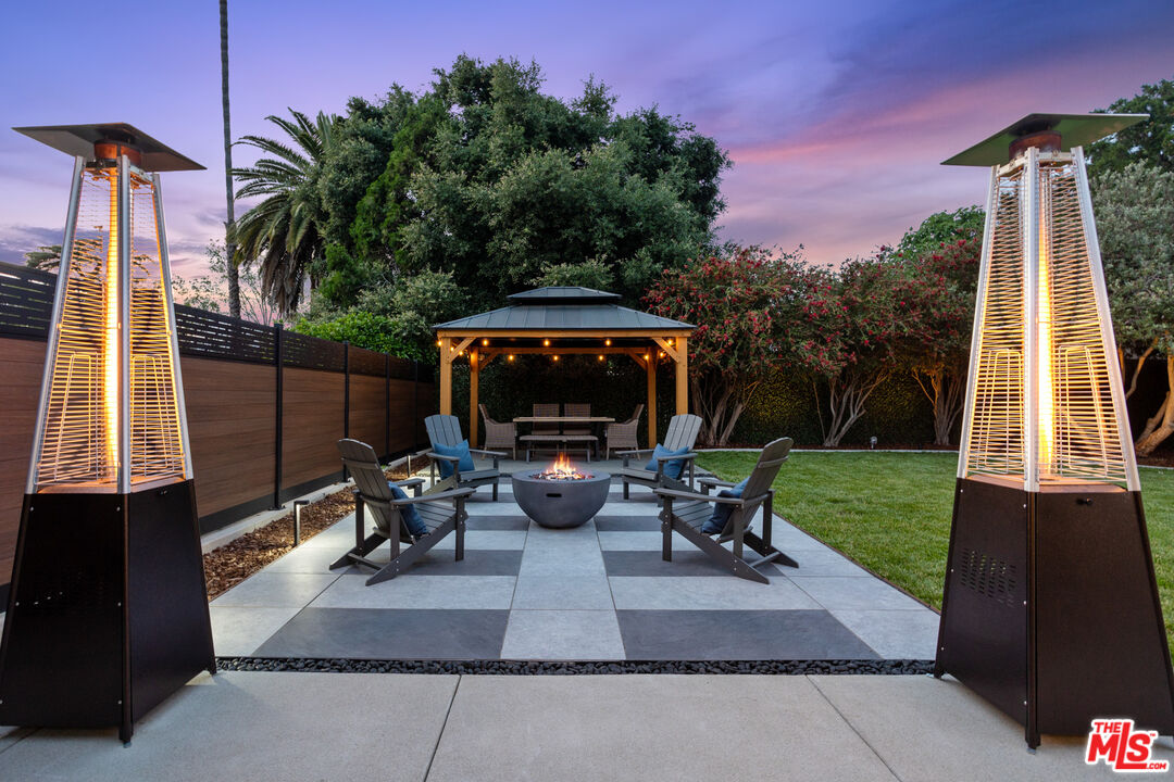 393 Allendale Road Pasadena, CA 91106 - Photo 64 of 75 a view of a patio with table and chairs potted plants with wooden floor