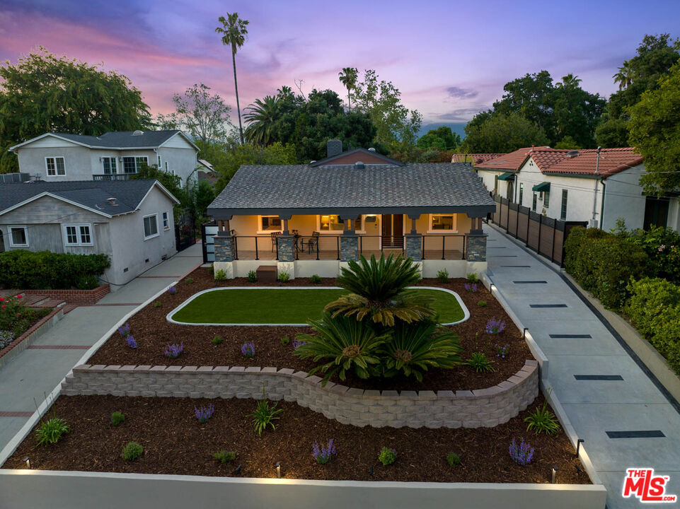 393 Allendale Road Pasadena, CA 91106 - Photo 69 of 75 a view of a white house with a yard plants and large tree
