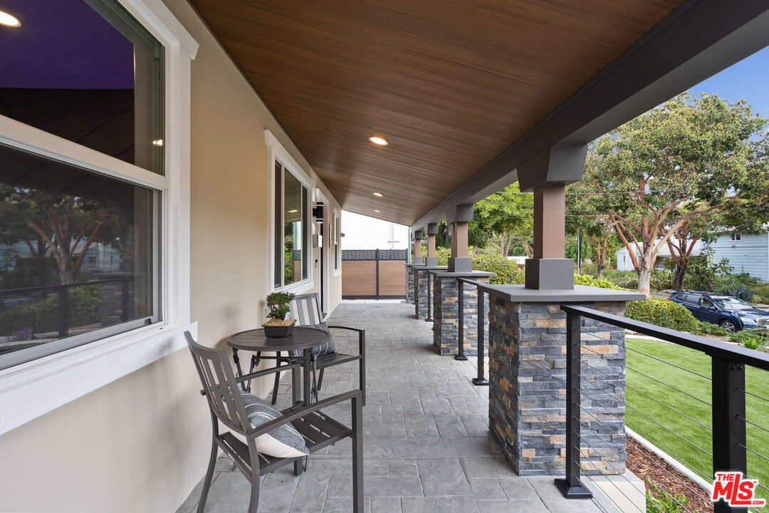393 Allendale Road Pasadena, CA 91106 - Photo 7 of 75 a view of a porch with furniture and garden