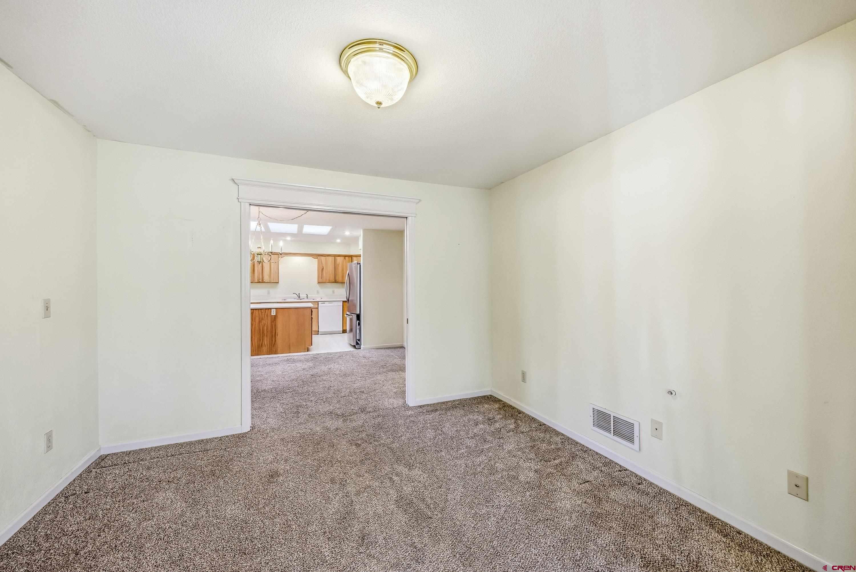 401 Grand Avenue, Unit B Delta, CO 81416 - Photo 4 of 14 flex space perfect for an office/den/library/home gym or guest room - this space sits between living room 1 & the dining room