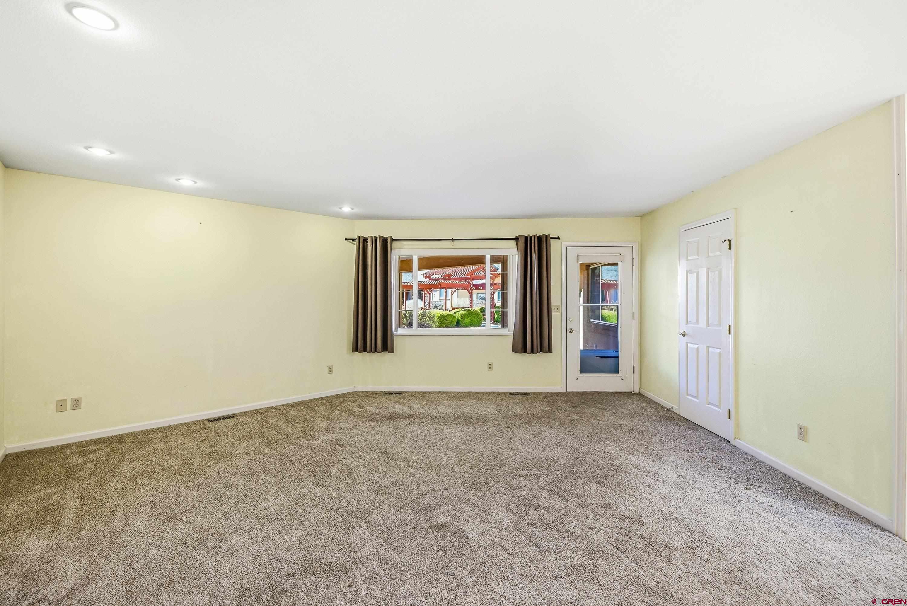 401 Grand Avenue, Unit B Delta, CO 81416 - Photo 7 of 14 an empty room with window