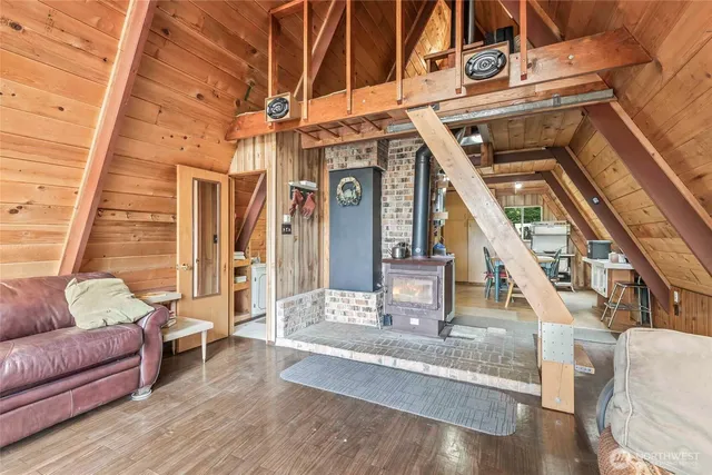 a view of living room with furniture and wooden floor