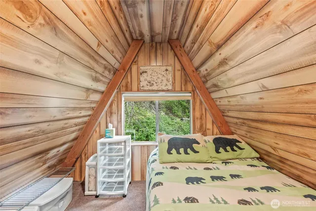 a view of a bedroom with a bed