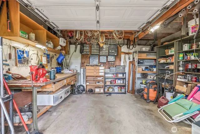 a view of a house with a backyard and trees