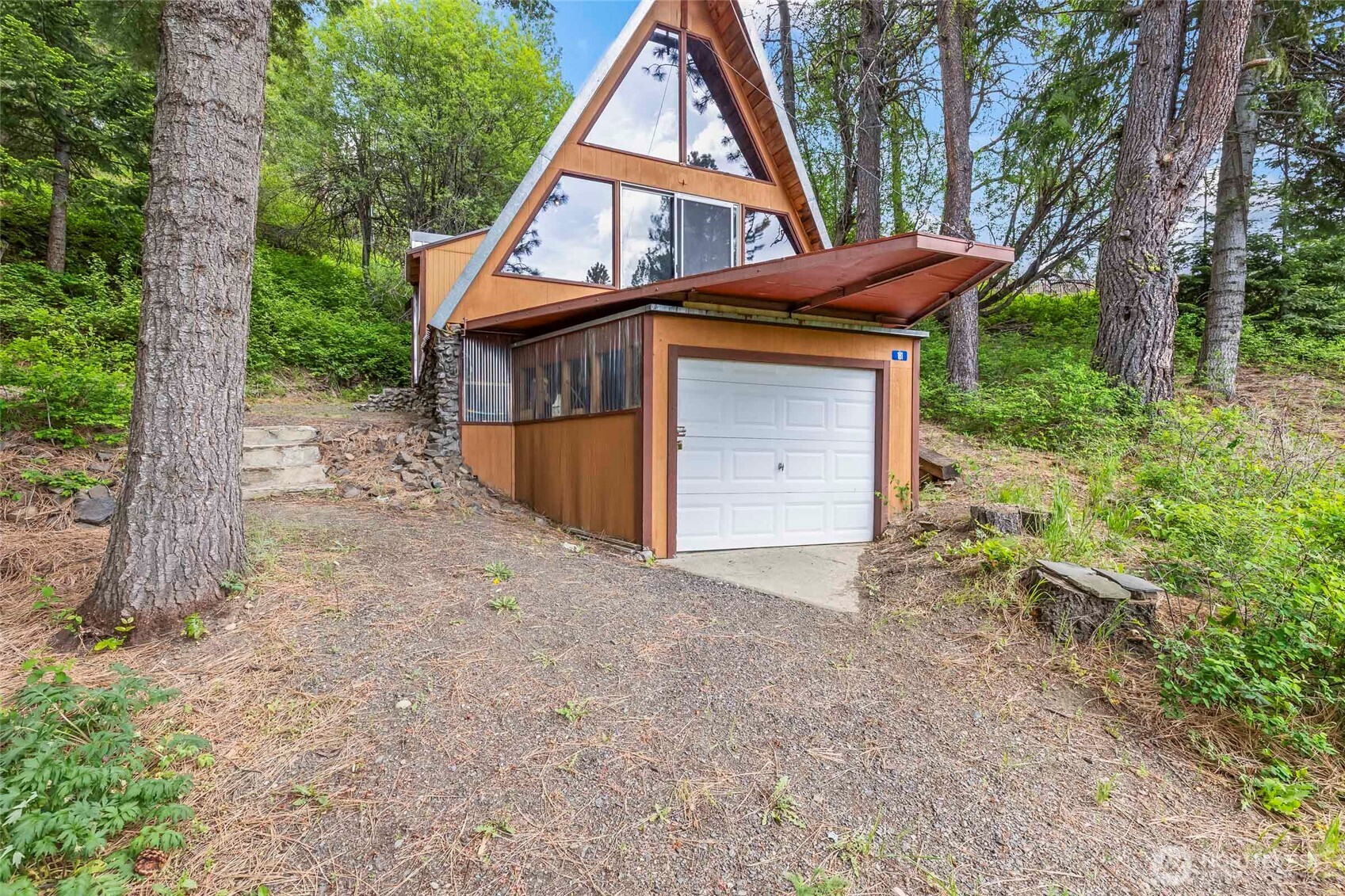 181 Elk Road Cle Elum, WA 98922 - Photo 19 of 31 a view of a house with a backyard and trees