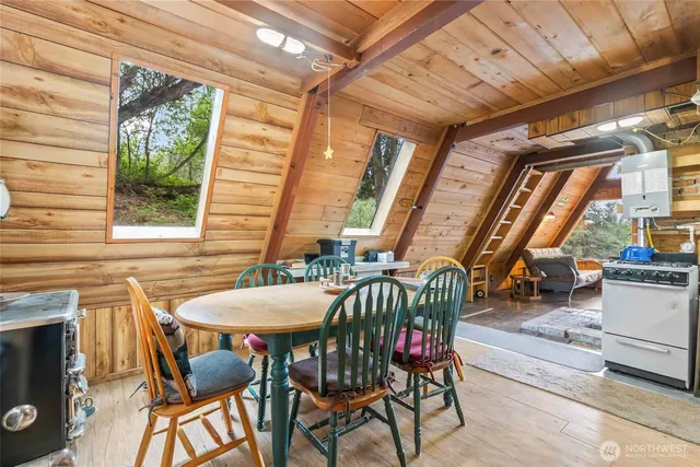 a view of a dining room with furniture window and outside view