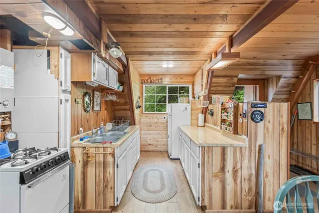 a utility room with multiple dryer and washer